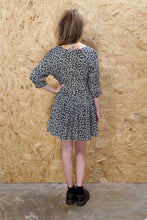 Black Long Sleeved Dress with Floral Print and Drop Waist
